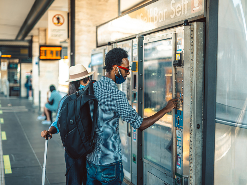 Man checking out on vending machine